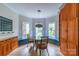 Cozy breakfast nook with built-in benches, pendant lighting, and a view of the outdoors at 416 E Park Ave, Charlotte, NC 28203