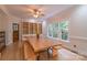Bright dining room featuring custom wood table and bench seating with built-in cabinets and natural light at 416 E Park Ave, Charlotte, NC 28203