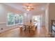 Bright dining room with large windows, hardwood floors, and a modern table setting at 416 E Park Ave, Charlotte, NC 28203