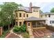 Exterior elevation of home with screen porch and manicured back yard at 416 E Park Ave, Charlotte, NC 28203