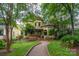 Charming Victorian home with a brick pathway and lush green lawn at 416 E Park Ave, Charlotte, NC 28203