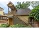 Exterior view of backyard detached structure showing stairs and second-story access at 416 E Park Ave, Charlotte, NC 28203