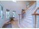 Spacious foyer featuring a staircase, hardwood floors, and natural light at 416 E Park Ave, Charlotte, NC 28203
