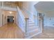 Bright foyer with hardwood floors and an elegant staircase at 416 E Park Ave, Charlotte, NC 28203