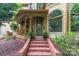 Close-up of the home's front porch, featuring brick steps and decorative railings at 416 E Park Ave, Charlotte, NC 28203