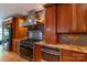 Chef's kitchen with stainless steel range, custom cabinets, and granite countertops at 416 E Park Ave, Charlotte, NC 28203