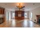 Expansive living room with hardwood floors, fireplace, and built-in shelving at 416 E Park Ave, Charlotte, NC 28203