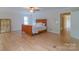 Large main bedroom featuring hardwood floors, a ceiling fan, and natural light at 416 E Park Ave, Charlotte, NC 28203