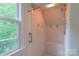 Tiled shower with bench seat and window at 416 E Park Ave, Charlotte, NC 28203