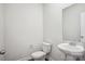Powder room features a pedestal sink and toilet with wood-look floors at 417 Bent Burr Crk, York, SC 29745