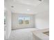 Upstairs hallway with carpet floors and a view of the neighborhood through two windows at 417 Bent Burr Crk, York, SC 29745