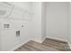 Functional laundry room featuring shelving, washer, dryer hookups, and durable flooring at 417 Bent Burr Crk, York, SC 29745