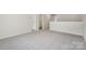 Open loft space with neutral carpet, natural light, and a view of the surrounding neighborhood at 417 Bent Burr Crk, York, SC 29745