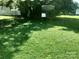 Well-maintained backyard with lush green grass and a chain-link fence around it at 447 17Th St, Cramerton, NC 28032