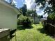 Spacious backyard with a well-maintained lawn, framed by a fence line and lush greenery at 447 17Th St, Cramerton, NC 28032