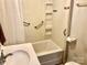 Bathroom featuring a shower-tub combination with a white sink and grab bars for assistance at 447 17Th St, Cramerton, NC 28032