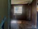 Bedroom featuring damage to the ceiling and wall damage around the window at 447 17Th St, Cramerton, NC 28032