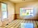 Bright room showcasing the black and cream tile flooring, paneling and natural light at 447 17Th St, Cramerton, NC 28032