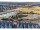 Aerial view of townhome community with ponds, recreation areas, and mature trees at 5062 Gribble Ln, Lancaster, SC 29720