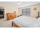 Comfortable bedroom with neutral carpet, a large dresser, and a view of a walk-in closet at 5062 Gribble Ln, Lancaster, SC 29720
