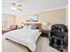 Spacious bedroom with a ceiling fan, a cozy seating area, and large bed at 5062 Gribble Ln, Lancaster, SC 29720