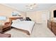 Primary bedroom featuring a bed, ceiling fan, and adjacent closet and a reading nook at 5062 Gribble Ln, Lancaster, SC 29720