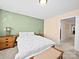 A cozy bedroom with a green accent wall, a comfortable bed, and an attached hallway at 5062 Gribble Ln, Lancaster, SC 29720