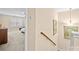 Hallway leading to a bedroom with carpeted floors, neutral walls, and artwork on the walls at 5062 Gribble Ln, Lancaster, SC 29720