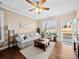 Comfortable living room featuring hardwood floors, natural light, and seamlessly connected to the dining area at 5062 Gribble Ln, Lancaster, SC 29720