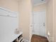 Mudroom with a bench, storage baskets, and hooks for organization, leading to an exterior door at 5062 Gribble Ln, Lancaster, SC 29720