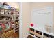 Spacious walk-in pantry with white shelving and an abundance of storage space with a drop zone and a bench at 5062 Gribble Ln, Lancaster, SC 29720