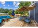 Inviting back deck with comfortable seating, dining area, grill, and privacy fence offering outdoor relaxation at 516 King St, Waxhaw, NC 28173