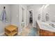 Bathroom featuring double sinks, wood cabinetry, a walk-in closet, and lots of counter space at 516 King St, Waxhaw, NC 28173