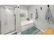Bright and modern bathroom with a glass enclosed shower and separate soaking tub at 516 King St, Waxhaw, NC 28173