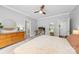 Spacious bedroom featuring a dresser with a plant, access to a closet, and a desk for work or personal use at 516 King St, Waxhaw, NC 28173