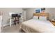 Comfortable bedroom with soft neutral colors, a desk for work or study, and artwork hung above a headboard at 516 King St, Waxhaw, NC 28173