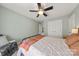 Bedroom with large window, ceiling fan, and access to an additional room with a closet for convenient storage at 516 King St, Waxhaw, NC 28173