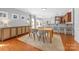 Open dining area with a modern table set, stylish buffet, and seamless flow to the kitchen at 516 King St, Waxhaw, NC 28173