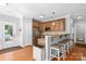 Functional kitchen with bar seating, stainless steel appliances, and easy access to the backyard at 516 King St, Waxhaw, NC 28173
