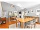 Spacious open living room featuring a vaulted ceiling, fireplace, hardwood floors and lots of light at 516 King St, Waxhaw, NC 28173