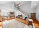 Bright living room with vaulted ceilings, hardwood floors, open floor plan to dining and staircase at 516 King St, Waxhaw, NC 28173