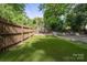 A backyard featuring a cozy outdoor seating area and pristine artificial turf, perfect for relaxation at 534 W Kingston Ave, Charlotte, NC 28203