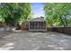 Charming brick home with a screened-in porch, complemented by a spacious parking area at 534 W Kingston Ave, Charlotte, NC 28203