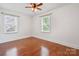 Bedroom with hardwood floors and two windows at 534 W Kingston Ave, Charlotte, NC 28203