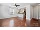 Inviting living space with hardwood floors, open to a modern kitchen and featuring ample natural light at 534 W Kingston Ave, Charlotte, NC 28203