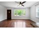 Bright living room featuring hardwood floors and a large window offering a view of the outside at 534 W Kingston Ave, Charlotte, NC 28203