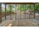 Charming screened-in porch with wood flooring, providing a cozy space to enjoy the outdoors at 534 W Kingston Ave, Charlotte, NC 28203