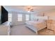 Serene bedroom with large windows providing natural light, ceiling fan, and neutral tones for a calming atmosphere at 5413 Austin Rd # 4, Monroe, NC 28112