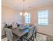 Elegant dining room featuring a dark wood table, upholstered chairs, and wainscoting at 5413 Austin Rd # 4, Monroe, NC 28112
