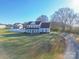 Two-story home with a beautiful lawn, mature trees, and a long driveway at 5413 Austin Rd # 4, Monroe, NC 28112